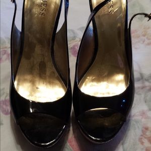 Guess black patent leather wedgies with gold heel